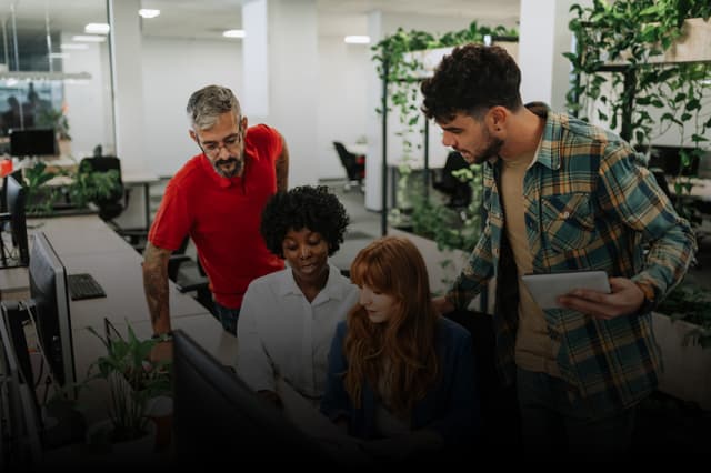 Business Executive Training: Woman in yellow shirt presenting to a group in a meeting room